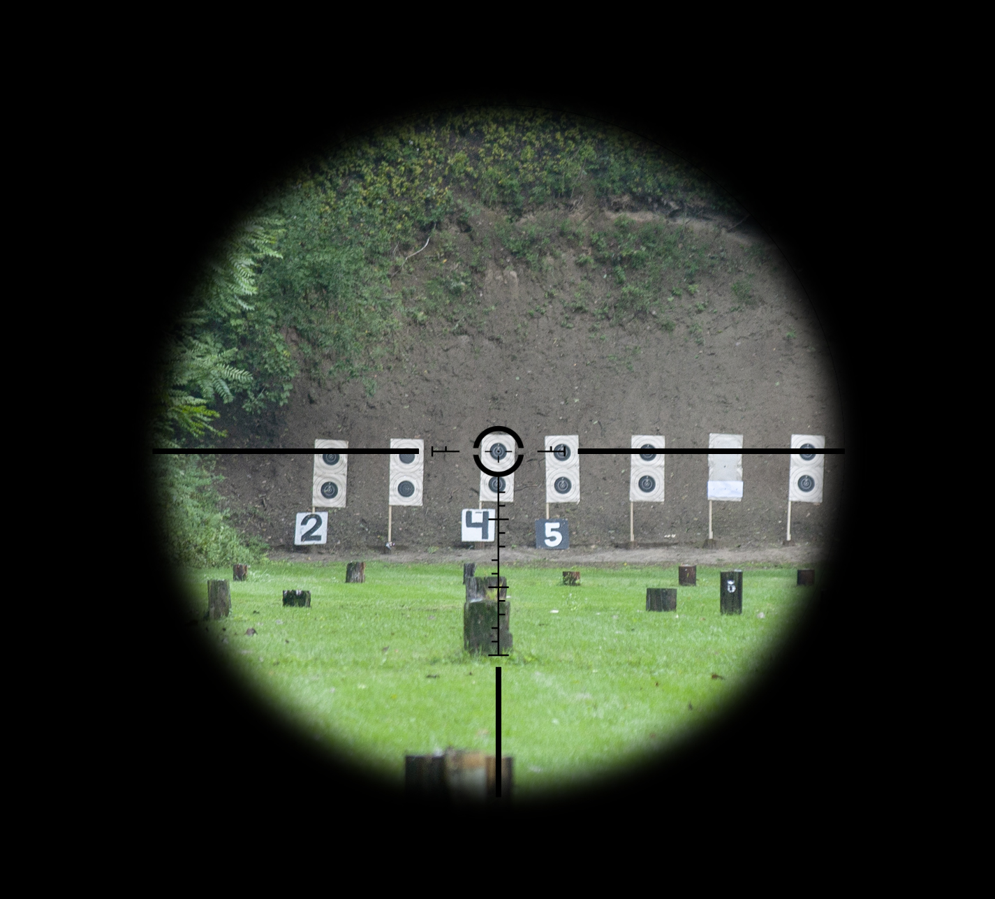 View through the Athlon Helos BTR scope toward a service-rifle target backer
